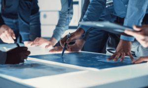 People looking at blueprints