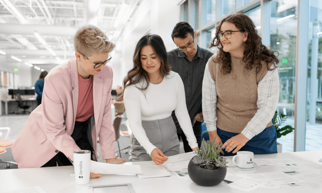 Group of people collaborating around a table.